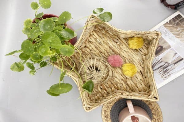 Star-shaped water hyacinth tray with decorations, boho style