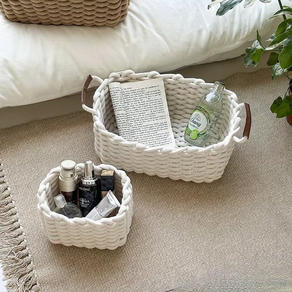 White cotton rope basket with skincare products and sparkling water